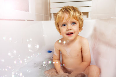 High angle view of young woman in bathroom