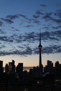 Modern buildings in city at sunset