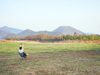 Solo traveler enjoying to beautiful landscape mountain lake.