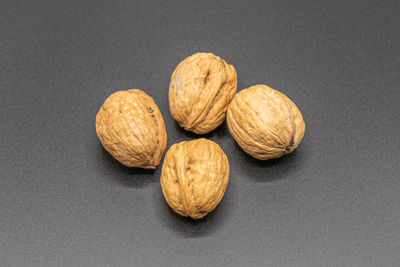 Close-up of fruits on table against black background