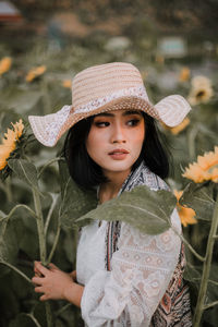 Portrait of a young woman wearing hat