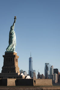 Statue of buildings against clear sky