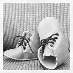 Close-up of shoes on tiled floor