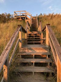 Staircase of field against sky