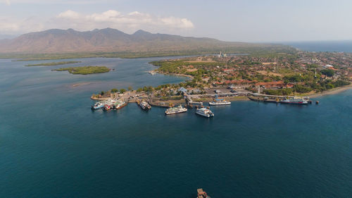 Aerial view ferry port gilimanuk with ferry boats, vehicles. 