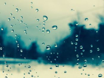 Full frame shot of wet blue glass