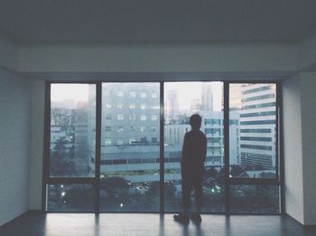 Woman standing against wall