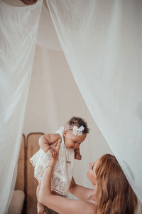 Rear view of mother and daughter