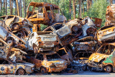 Cemetery of wrecked and destroyed civilian vehicles near kiev during the fighting .