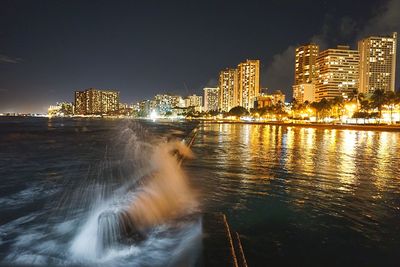 River passing through city at night