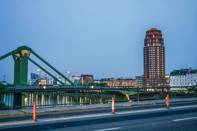 Road in city against clear sky