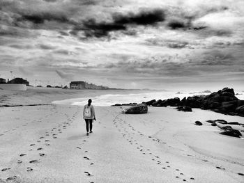 Rear view of woman on beach