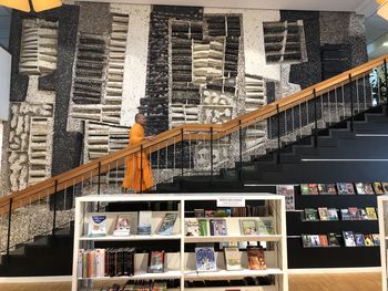 High angle view of books on railing