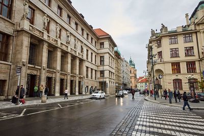 City street and buildings against sky