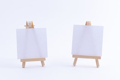 Close-up of empty seats against white background