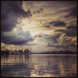 Scenic view of sea against cloudy sky