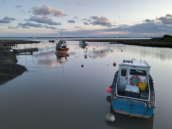 Sunset over boats in stone creek harbour, sunk island, east riding of yorkshire, uk