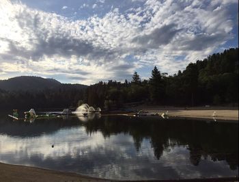 Scenic view of lake against cloudy sky