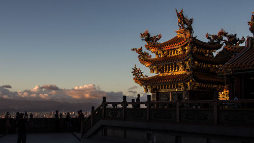 Group of people in temple against building