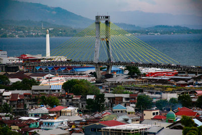 Soekarno bridge and tugu likin are two icons of manado city north sulawesi province, indonesia. 