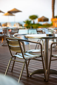 Empty chairs and table in restaurant