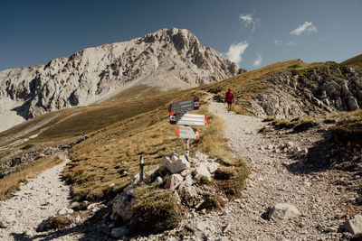 Rear view of man walking on mountain