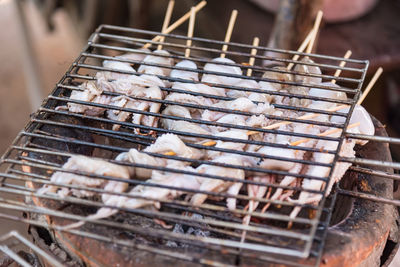 Close-up of meat on barbecue grill