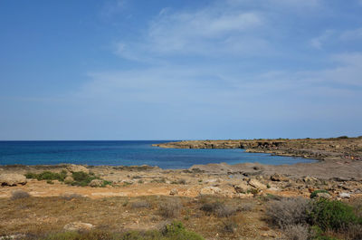 Scenic view of sea against blue sky