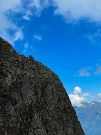 Low angle view of rock formation against sky