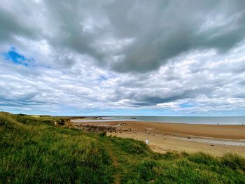 Scenic view of beach against sky