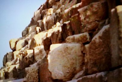 Low angle view of stone wall