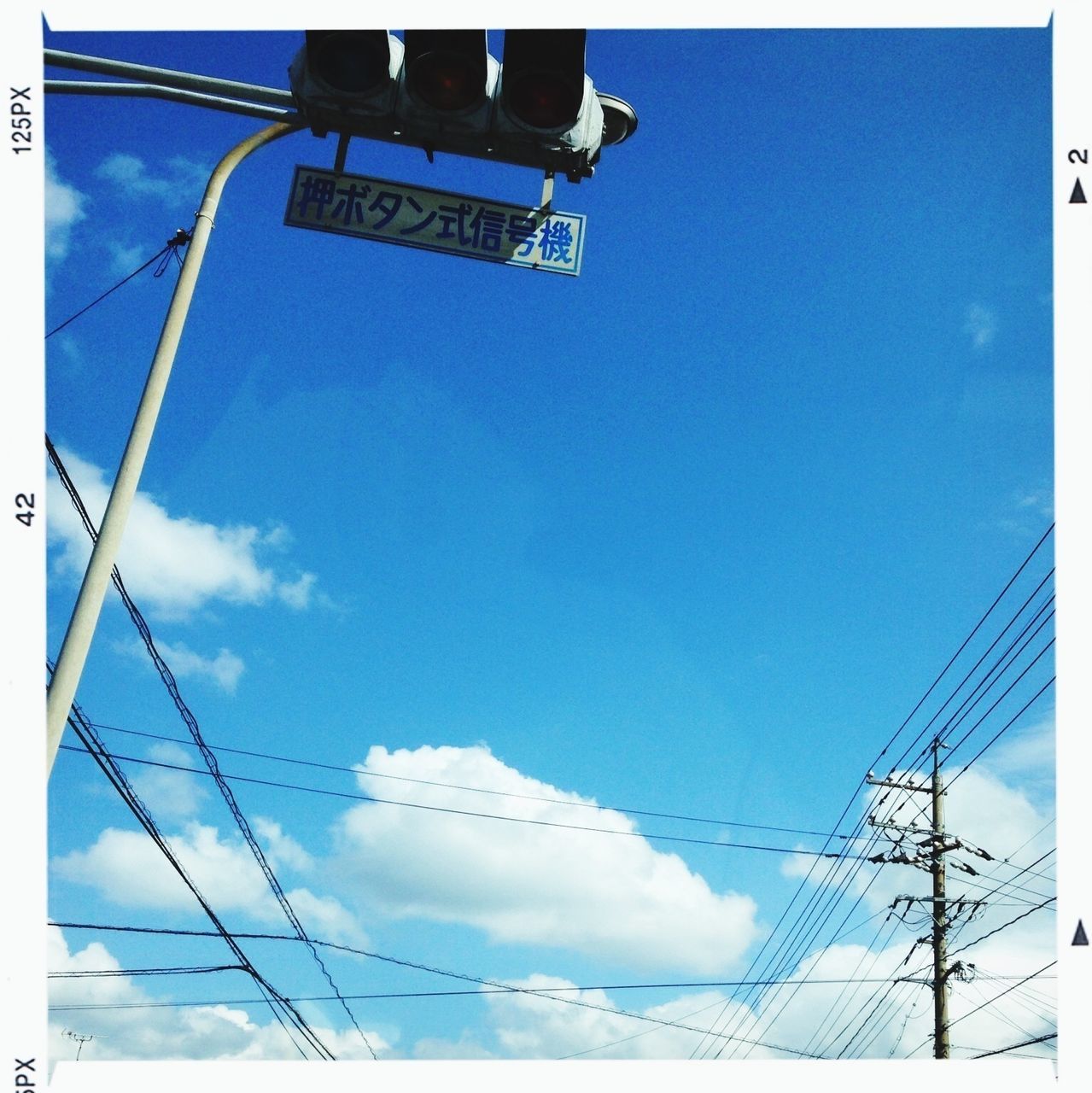 low angle view, power line, electricity, power supply, cable, electricity pylon, blue, sky, connection, fuel and power generation, power cable, technology, cloud - sky, cloud, pole, day, no people, outdoors, transfer print, vapor trail