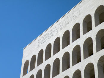 Low angle view of historical building against blue sky