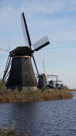 Traditional windmill against sky