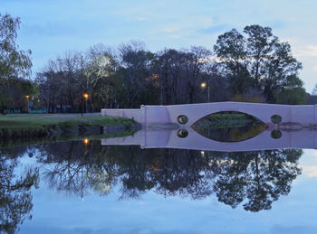 Reflection of trees in lake against sky