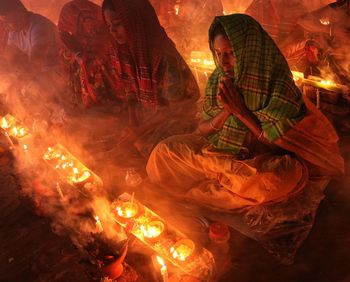 Spiritual moment of a women praying at rakher upobash barodi lokhnath brahmachari ashram 