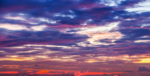 Low angle view of dramatic sky during sunset