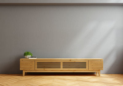 Cabinet for led tv in living room interior wall mockup on dark concrete wall.3d rendering