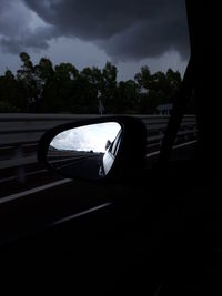 Reflection of car on side-view mirror