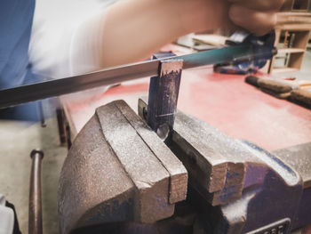 Close-up of hands working on table