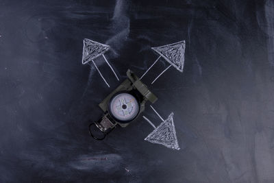 High angle view of clock on table