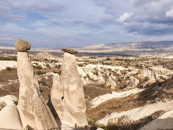 Panoramic view of rock formations against sky