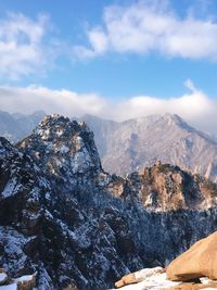 Scenic view of snowcapped mountains against sky