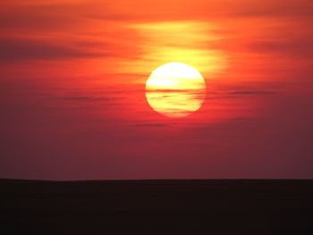 Scenic view of silhouette landscape against romantic sky at sunset