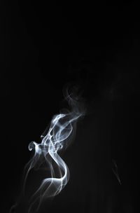 Close-up of smoke against black background