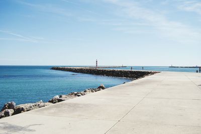 Scenic view of sea against blue sky