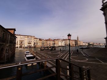 Buildings in city against sky at dusk