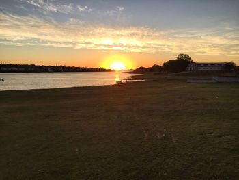 Scenic view of beach against sky during sunset