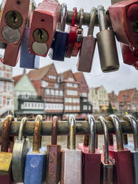 Close-up of padlocks hanging on railing