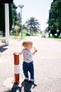 Full length of cute boy standing outdoors